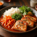 A plate with grilled tofu slices in sauce, inspired by recipes from Taiwan, garnished with chives, served alongside shredded white radish, julienned carrots, green peas, fresh herbs, and a lemon wedge on a wooden table.