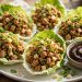 Asian chicken lettuce wraps in butter lettuce cups with hoisin dipping sauce