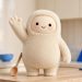 Muse mascot in a studio hero shot with a wooden spoon