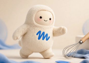 Muse mascot with a whisk in a studio portrait