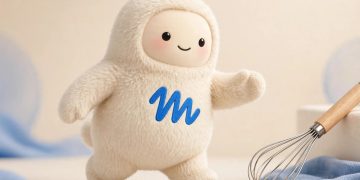 Muse mascot with a whisk in a studio portrait