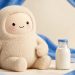 Muse mascot with a milk bottle in a studio portrait