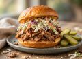 Pulled pork sandwich with coleslaw on a toasted brioche bun
