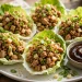 Asian chicken lettuce wraps in butter lettuce cups with hoisin dipping sauce
