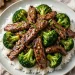 Beef and broccoli stir-fry with glossy garlic-ginger sauce served over steamed rice