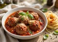 Italian meatballs in marinara sauce topped with parmesan and basil