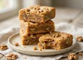 Maple walnut blondies stacked on a plate