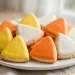 Candy corn sugar cookies in white orange and yellow wedges