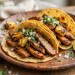Homemade tacos al pastor with grilled pork, pineapple, onion and cilantro on corn tortillas